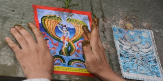 परम्परा अनुसार घरका मूलढोकामा नागको तस्बिर टाँसी पूजार्चना गरी नागपञ्चमी पर्व मनाइँदै
